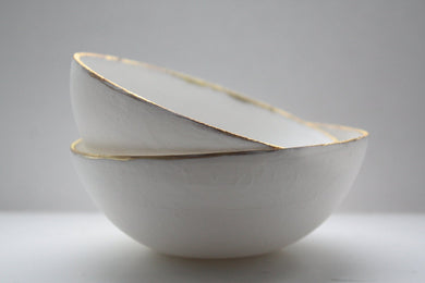 English fine bone china stoneware bowl with mat gold rims.