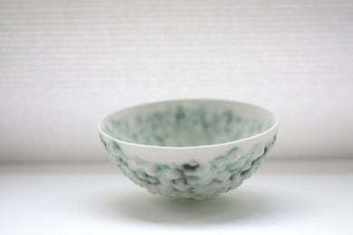 Stoneware bowl from English fine bone china with a unique textured surface and a hint of green