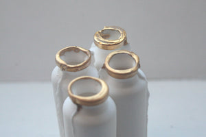 Small white bottle with gold finish from bone china.