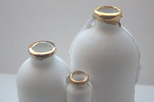 Trio of English fine bone china bottles with gold rims