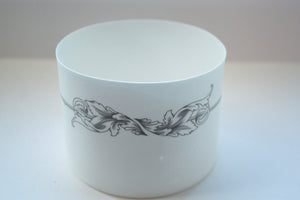White candle holder. Fine white bone china stoneware vessel or tealight holder with a black motif.