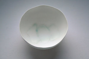 Small decorative bowl. Decorative stoneware fine bone china small bowl with green and purple hue.