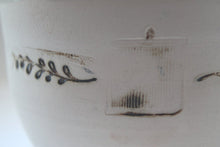Load image into Gallery viewer, Earthenware vessel handthrown with an aged look and embossed branches and bird cage