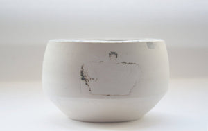 Round bowl. Small earthenware vessel handthrown with an aged look and embossed royal crowns