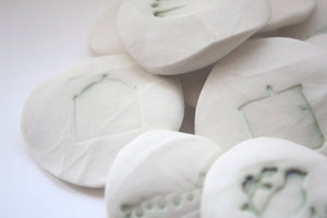 Stoneware Royal porcelain pebble with an imprint of a birdcage