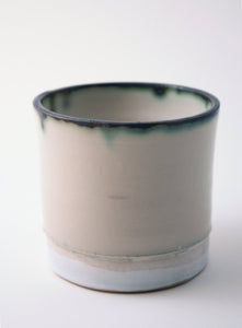 Handthrown  stoneware vessel with rusty look and unusual interior
