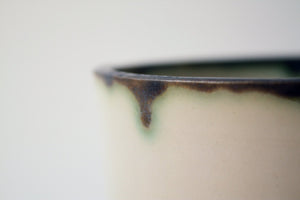 Handthrown  stoneware vessel with rusty look and unusual interior
