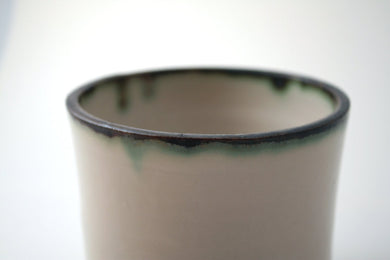 Handthrown  stoneware vessel with rusty look and unusual interior
