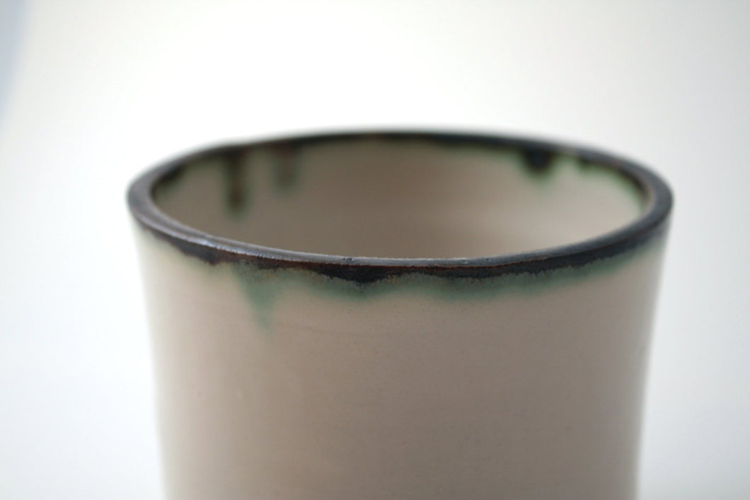 Handthrown  stoneware vessel with rusty look and unusual interior
