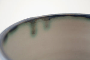 Handthrown  stoneware vessel with rusty look and unusual interior