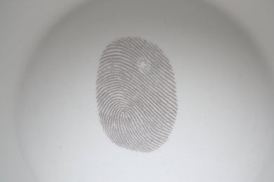 Stoneware fine bone china container or tealight holder with a grey fingerprint. Illustrated ceramics