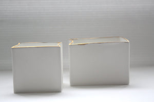 Pure white cube set made from fine bone china and real gold mat rims - geometric decor
