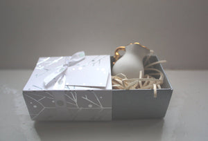 White gift box matchbox style with silver branches and ribbon,