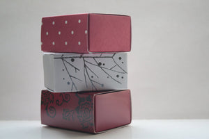 White gift box matchbox style with silver branches and ribbon,