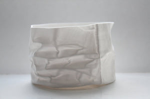 Crumpled paper looking white vessel made out of English fine bone china