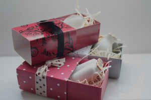 Red gift box matchbox style with black floral pattern and ribbon