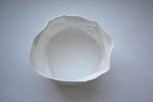 Crumpled paper looking vessel made out of English fine bone china and mother of pearl.