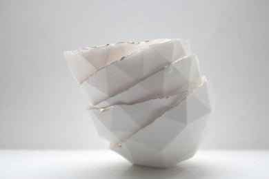 Geometric faceted polyhedron white bowl made from fine bone china with real gold finish in 4 sizes