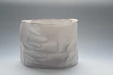 White with gold vessel. Crumpled paper-looking vessel made out of fine bone china with real gold