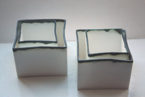 Pure white cube set made from fine bone china and burnt effect rims - geometric decor