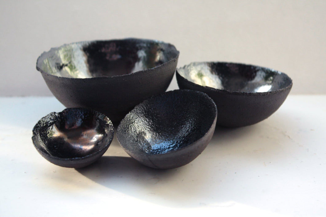 Limited Edition set of 4 chocolate black earthenware nesting bowls & metal graphite glaze interior.