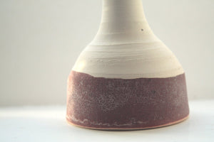 Abstract chunky small earthenware ceramic bottle with red glaze, hand thrown