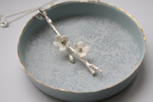 Solid silver long drop pendant with porcelain flowers - cherry blossom branch - silver twig pendant