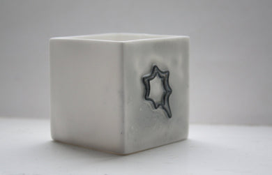 Small snow white cube made from fine bone china and embossed star shape pattern - geometric decor