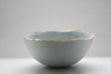 Load image into Gallery viewer, Stoneware porcelain bowl in duck egg blue with mat gold rims mat interior and crystals.