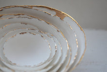Load image into Gallery viewer, Set of 7 stoneware fine bone china nesting bowls with real gold.