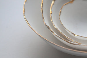 Set of 4 English fine bone china nesting stoneware bowls with real gold.